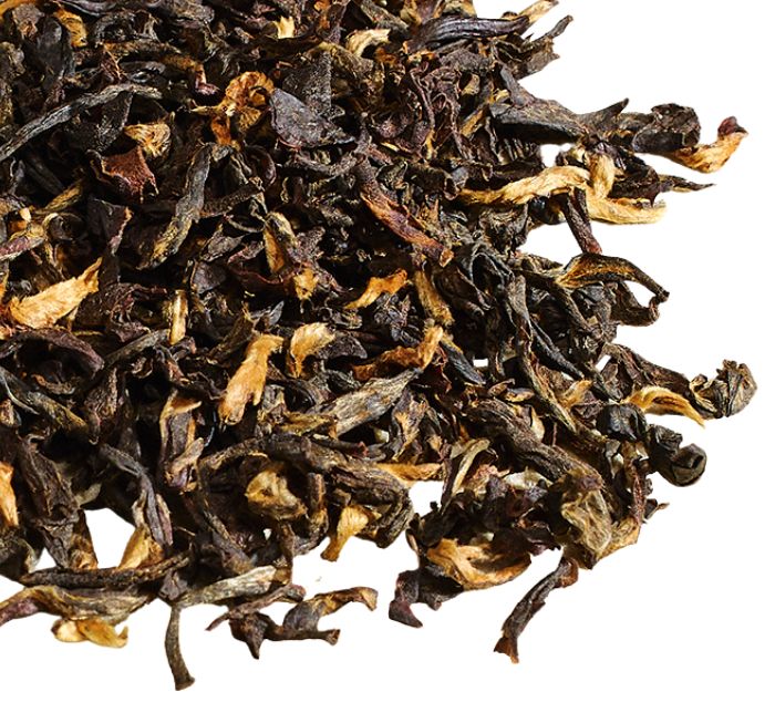Meleng Estate Assam loose leaf tea on a white surface