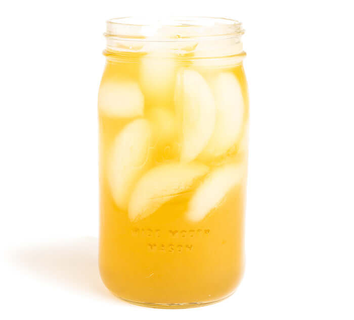 Boulder Blues Iced Tea Brewed in a mason jar on a white background
